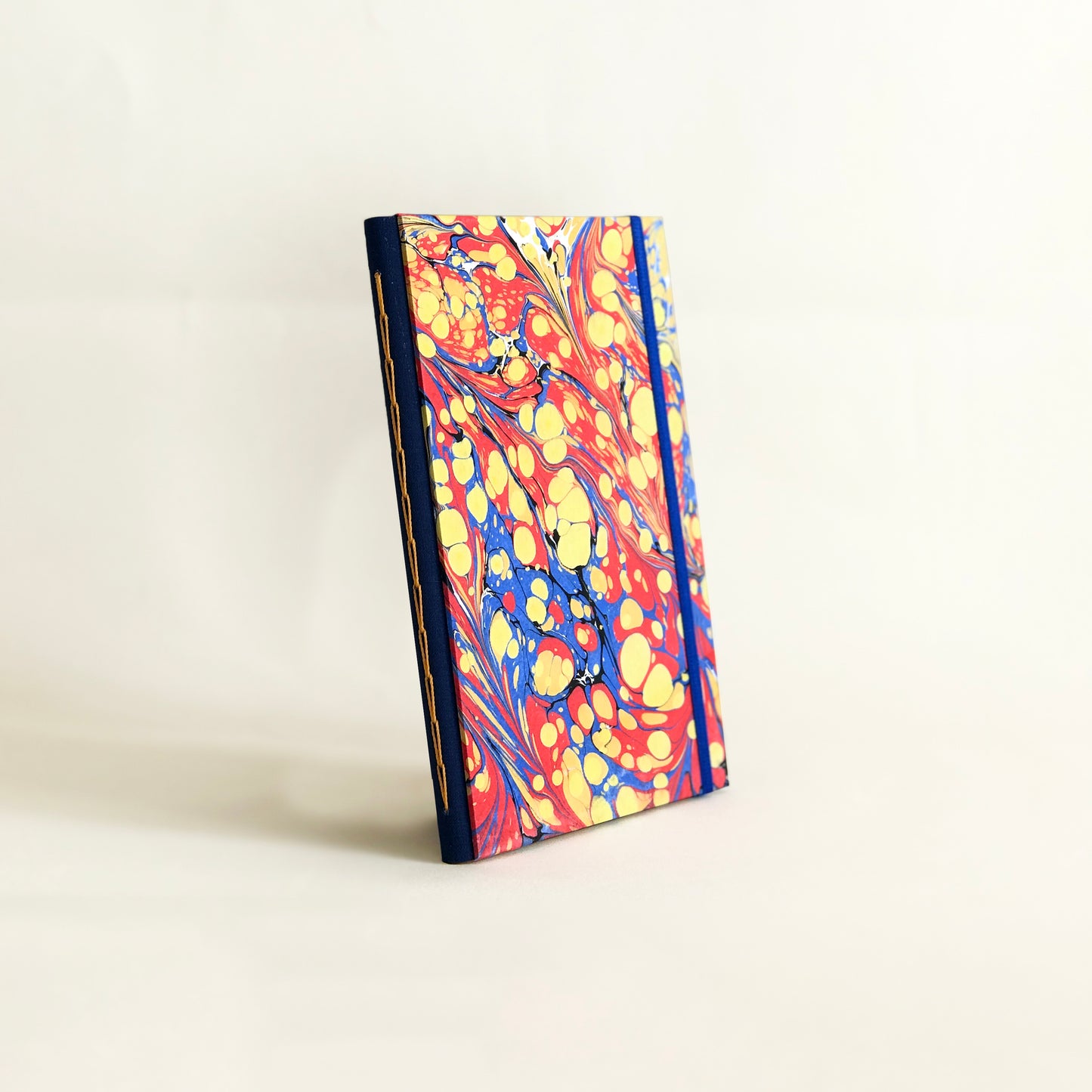 Journal marbré - jaune, rouge et bleu