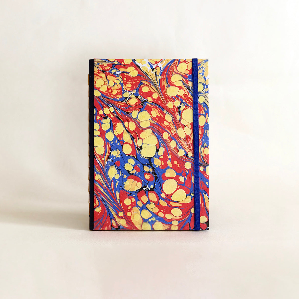 Journal marbré - jaune, rouge et bleu